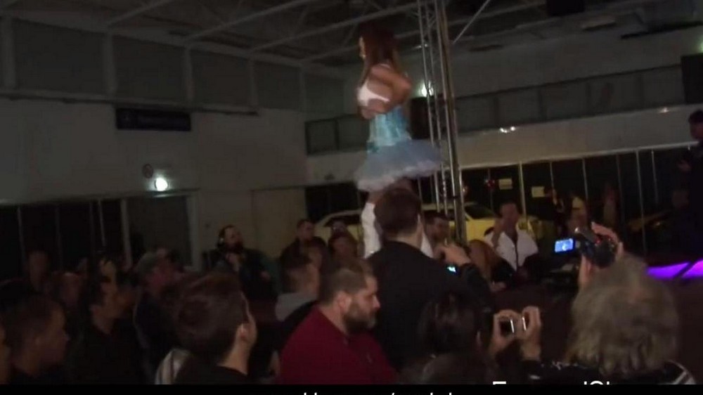 Hot brunette learns the art of striptease on a pole - porn video  
