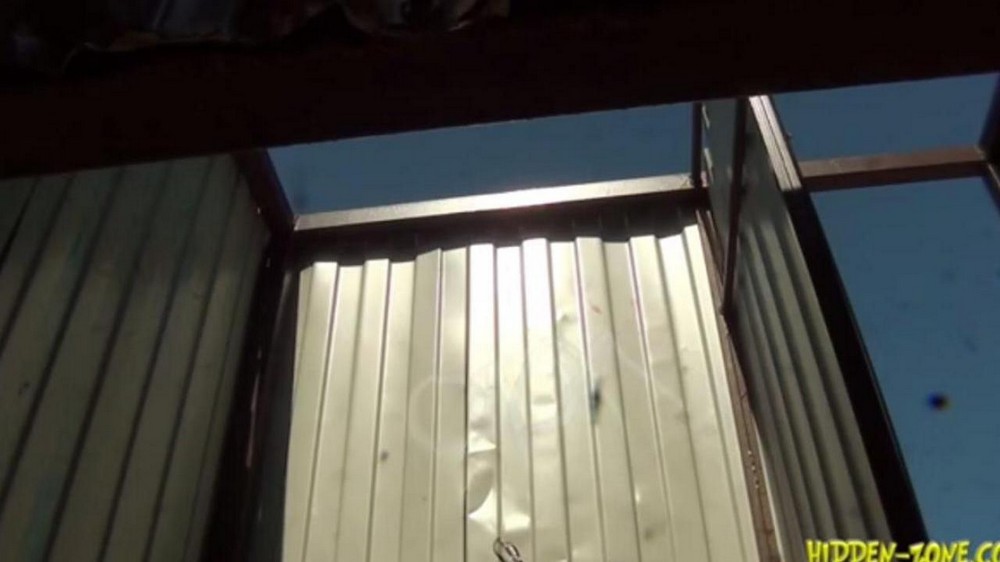 Hi*** camera films a woman in a beach cabin - porn video  