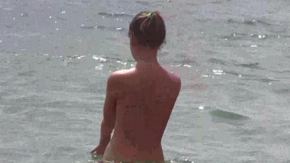 Naked nudists on the beach - porn video  