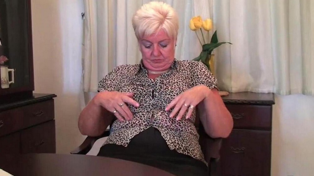 The old woman undresses in front of the camera and takes out dildos - porn video  