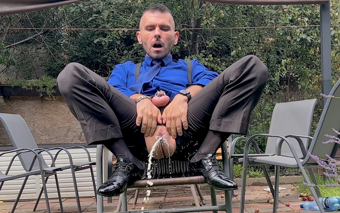Suited Man With Locked Dick Is Playing With His Man Cunt And Pissing In Public In Sheer Socks - porn video  