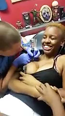 Nipple Pops Out While Getting Tatted - porn video  