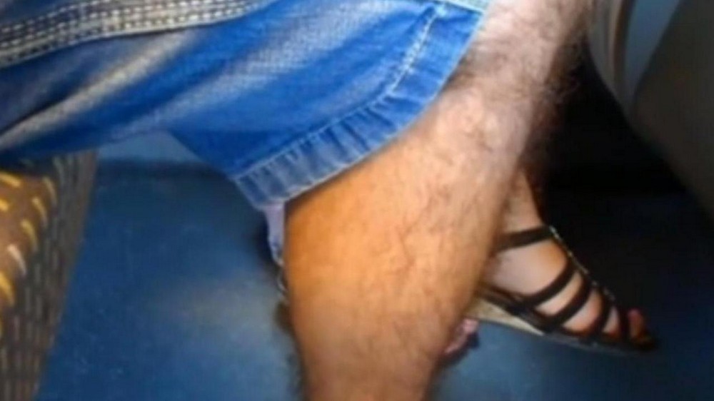 He reached under the womans skirt with his hand and began to knead the vagina with his fingers - porn video  